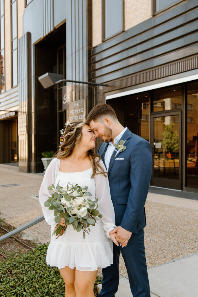 Bride and Groom's Portraits in Downtown Tyler, Texas for Intimate Wedding Day captured by Lizzie Hillard Photography.