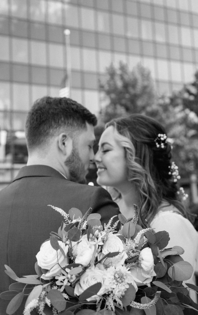 Bride and Groom's Portraits in Downtown Tyler, Texas for Intimate Wedding Day captured by Lizzie Hillard Photography.