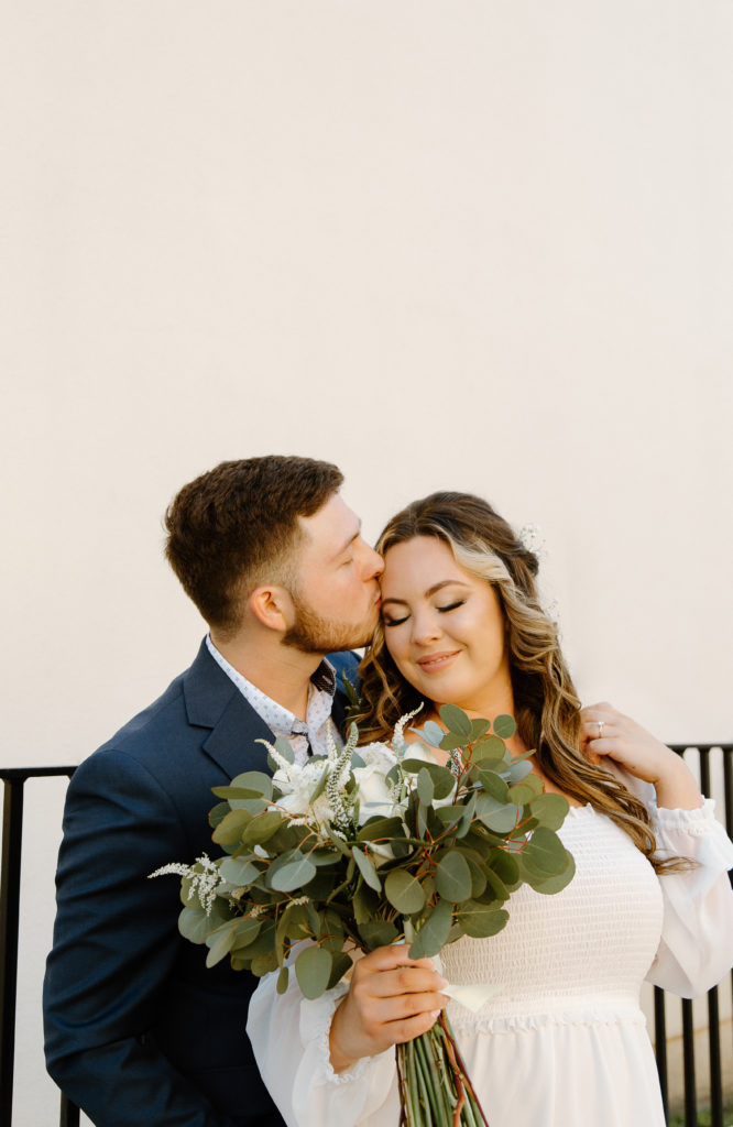 Bride and Groom's Portraits in Downtown Tyler, Texas for Intimate Wedding Day captured by Lizzie Hillard Photography.