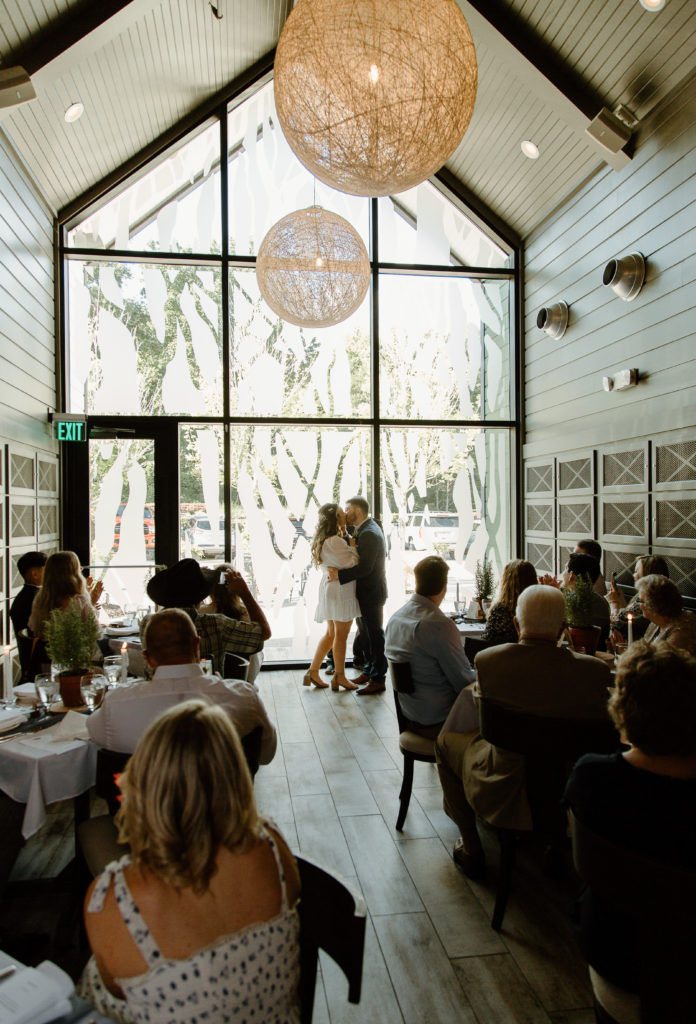 Intimate Wedding Ceremony in The Wine Room at The Grove Kitchens + Garden in Tyler, Texas captured by Lizzie Hillard Photography.