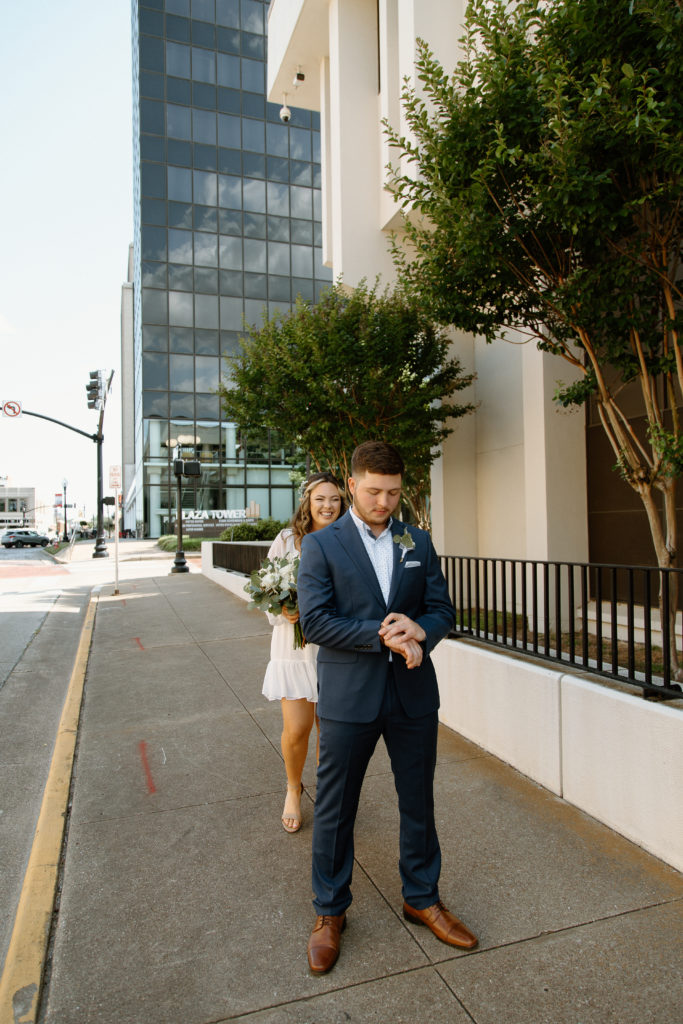 Bride and Groom's First Look in Downtown City. 