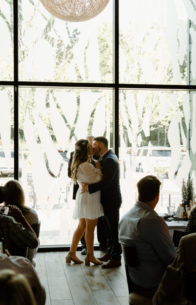 Intimate Wedding Ceremony in The Wine Room at The Grove Kitchens + Garden in Tyler, Texas captured by Lizzie Hillard Photography.