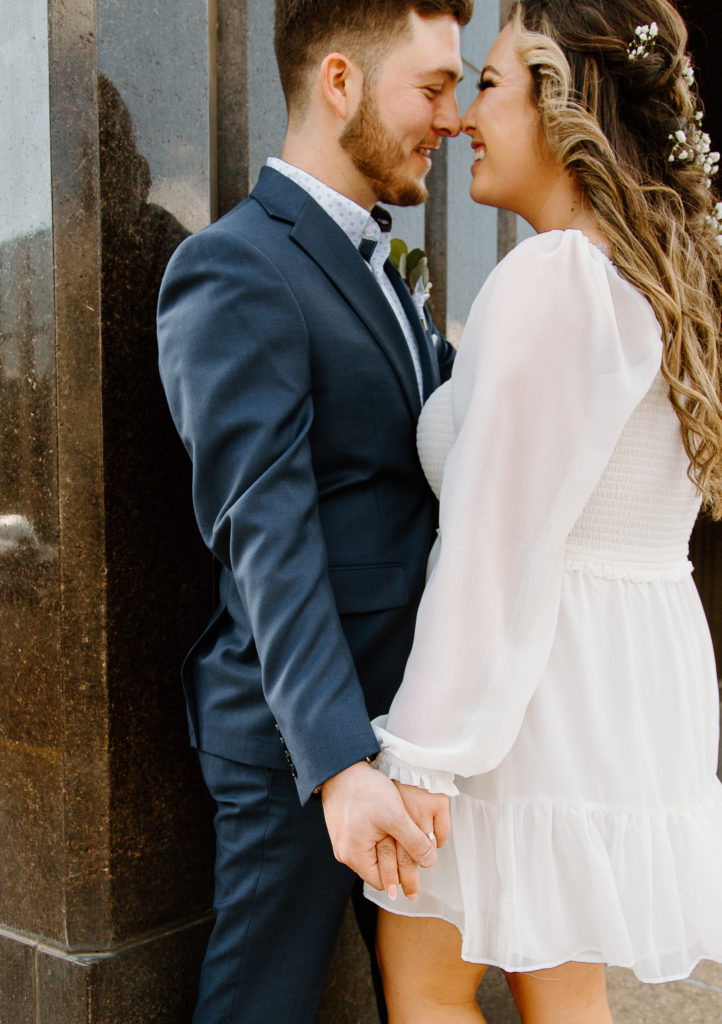 Bride and Groom's Portraits in Downtown Tyler, Texas for Intimate Wedding Day captured by Lizzie Hillard Photography.