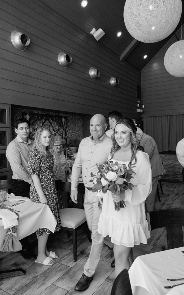 Intimate Wedding Ceremony in The Wine Room at The Grove Kitchens + Garden in Tyler, Texas captured by Lizzie Hillard Photography.