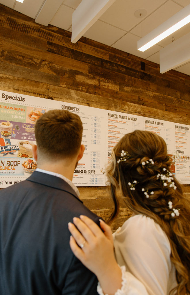 Bride and Groom's Portraits in Downtown Tyler, Texas for Intimate Wedding Day captured by Lizzie Hillard Photography. Ice cream at Andy's on the Tyler, Texas Square.