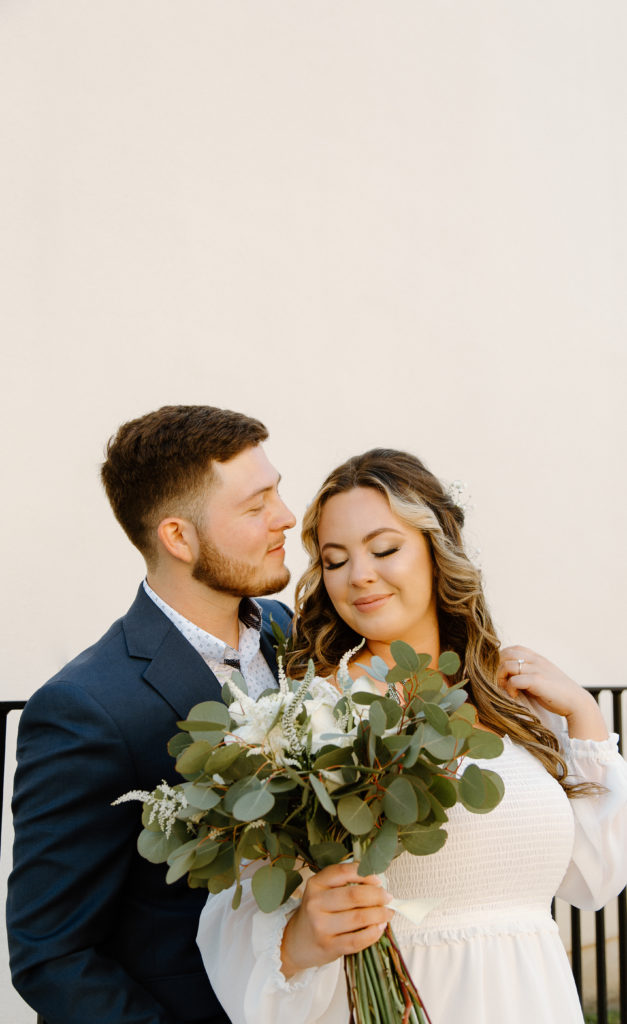 Bride and Groom's Portraits in Downtown Tyler, Texas for Intimate Wedding Day captured by Lizzie Hillard Photography.