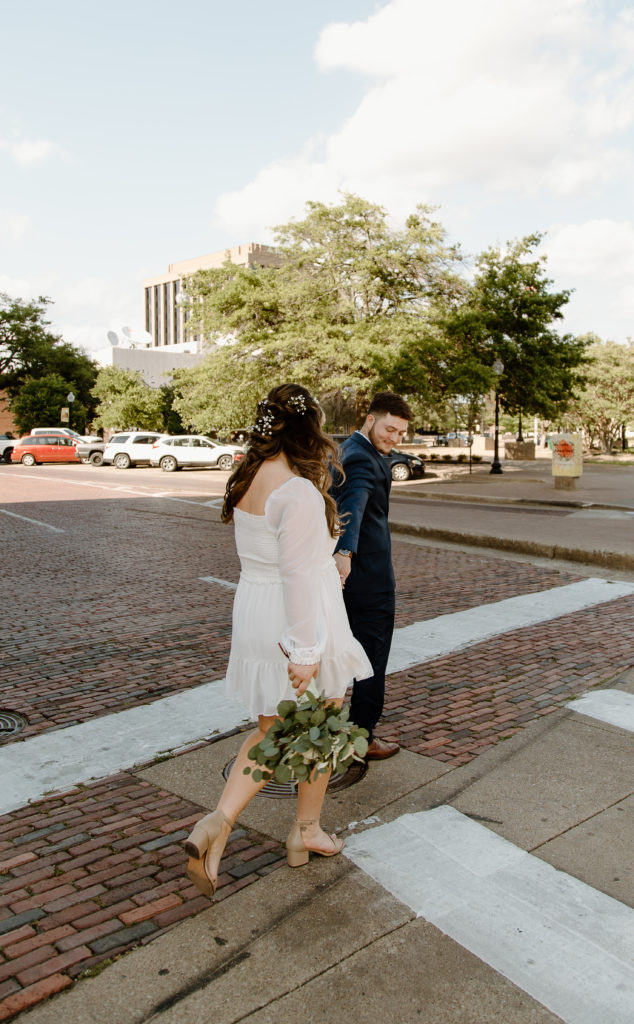 Bride and Groom's Portraits in Downtown Tyler, Texas for Intimate Wedding Day captured by Lizzie Hillard Photography.