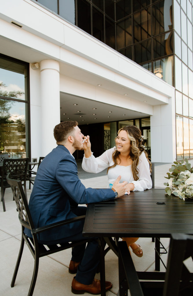 Bride and Groom's Portraits in Downtown Tyler, Texas for Intimate Wedding Day captured by Lizzie Hillard Photography. Ice cream at Andy's on the Tyler, Texas Square.