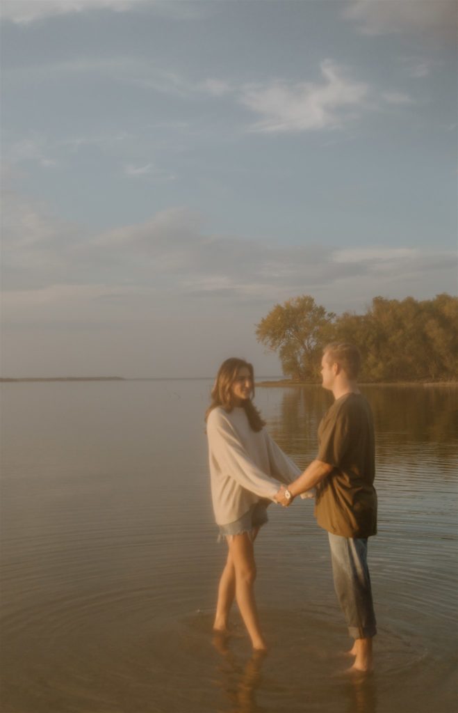 Couple holding hands during sunset at Lake Tawakoni.