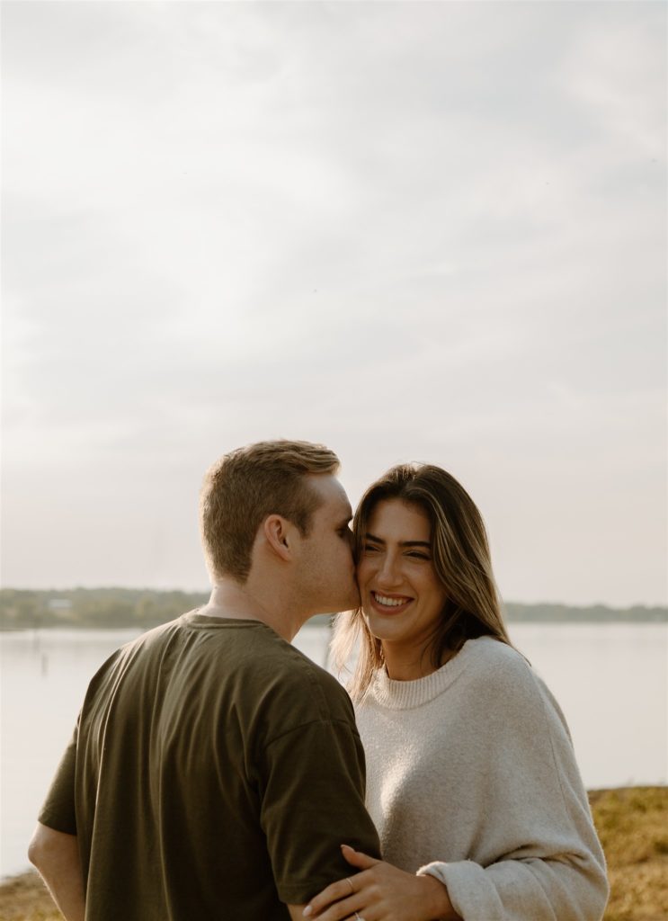 Couple kisses during engagement photos at Lake Tawakoni State Park.