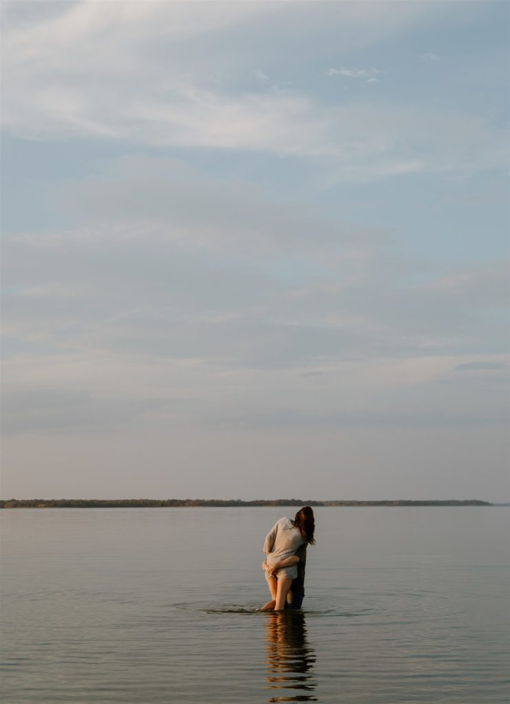 Couple in Lake Tawakni during engagement photos.