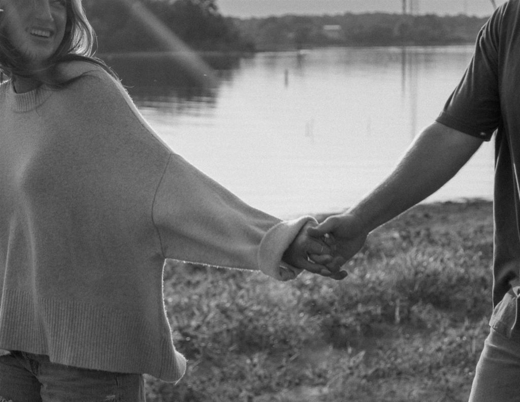 Couple holding hands detail photo in Canton, Texas.