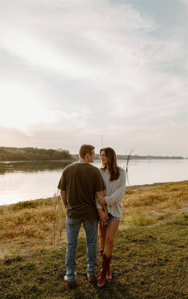 Couple poses during engagement session at Lake Tawakoni State Park.