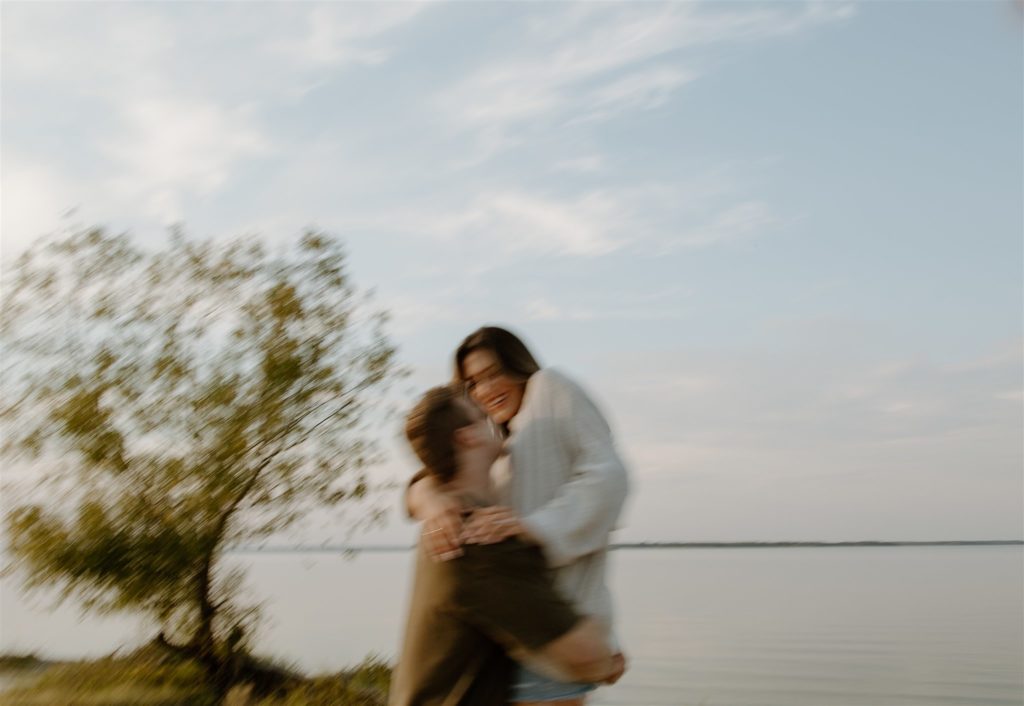 Motion blur of couple during engagement photos at Lake Tawakoni State Park.