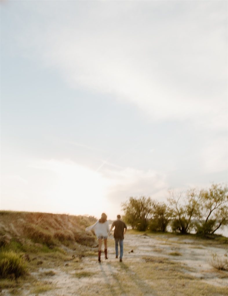 Motion blur of running away from camera during engagement photos at Lake Tawakoni State Park.