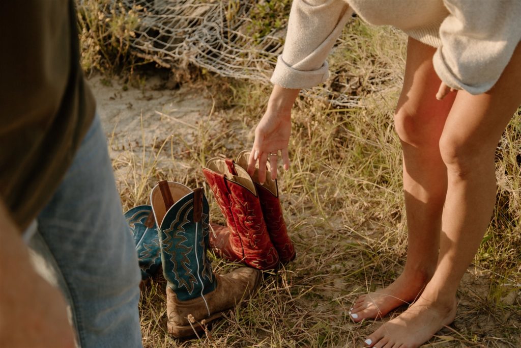 Shoes beside lake during texas engagement session.