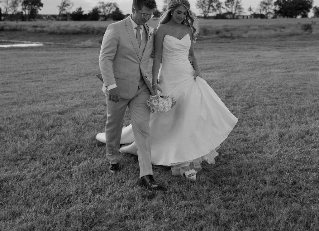 Bride and groom wedding attire details in black and white.