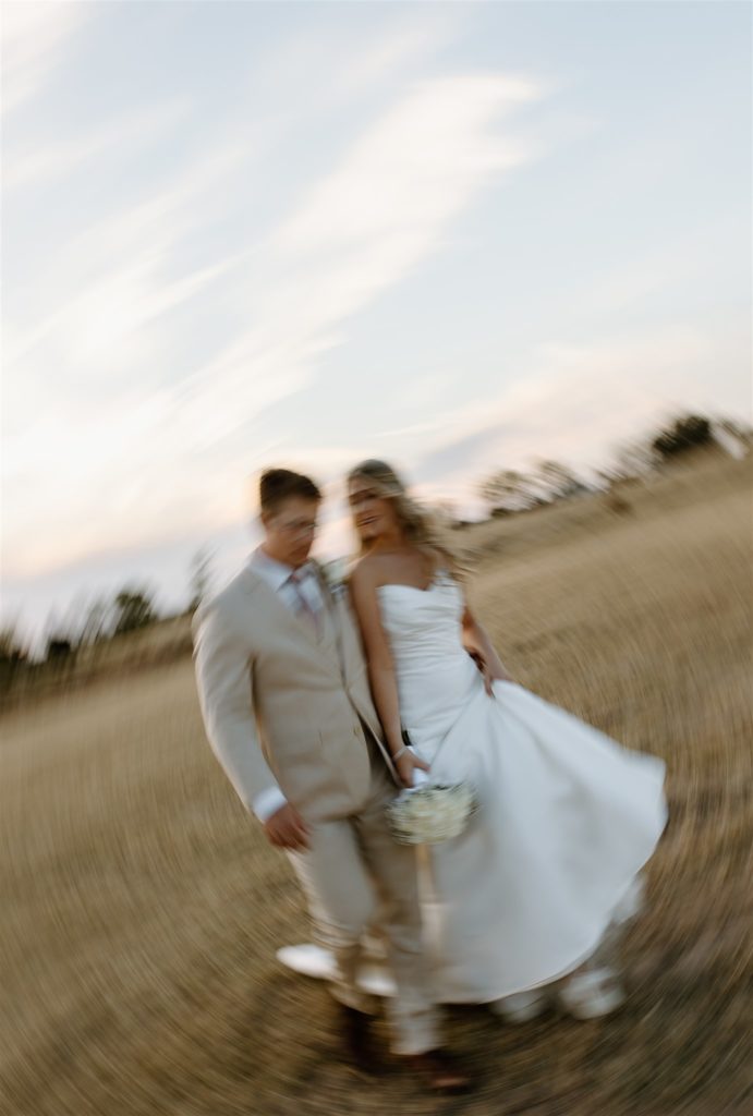 Creative bride and groom portrait walking towards the camera.