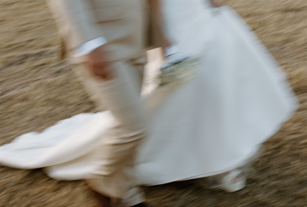 Bride and groom details motion blur during texas wedding.