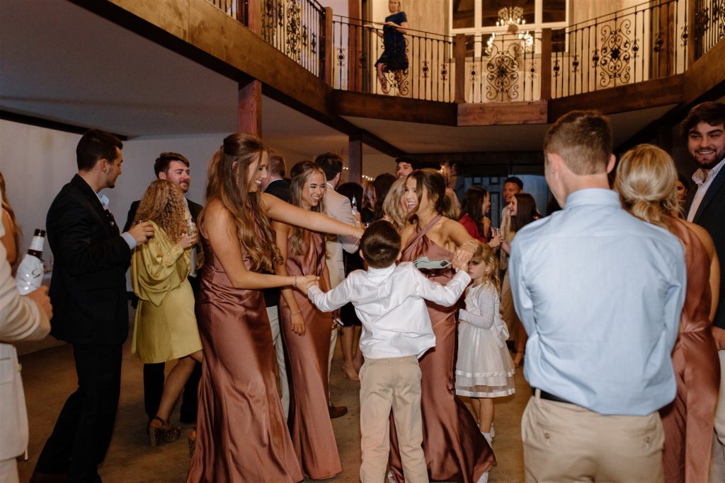 Guests dance during texas wedding reception.