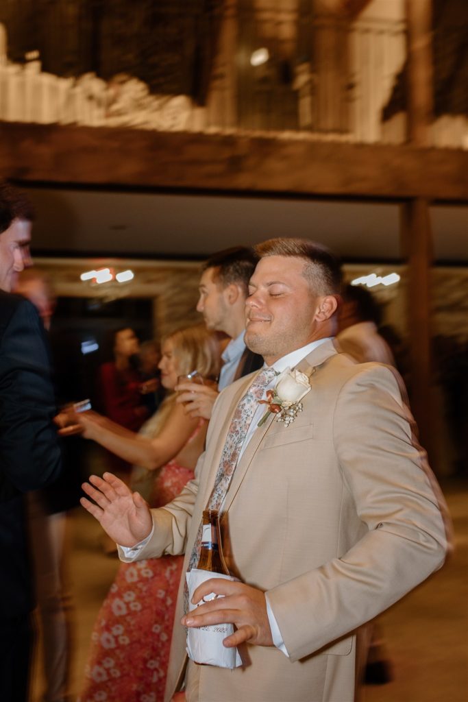 Guy dances at Texas wedding reception.