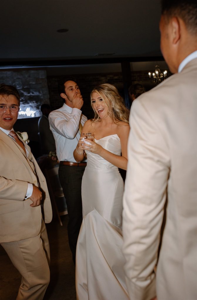 Candid of Bride laughing at texas wedding reception.