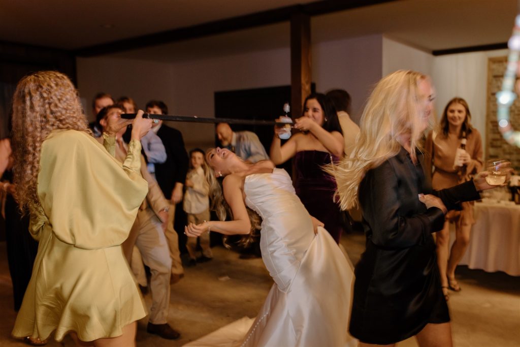 Bride limbos during texas wedding reception.