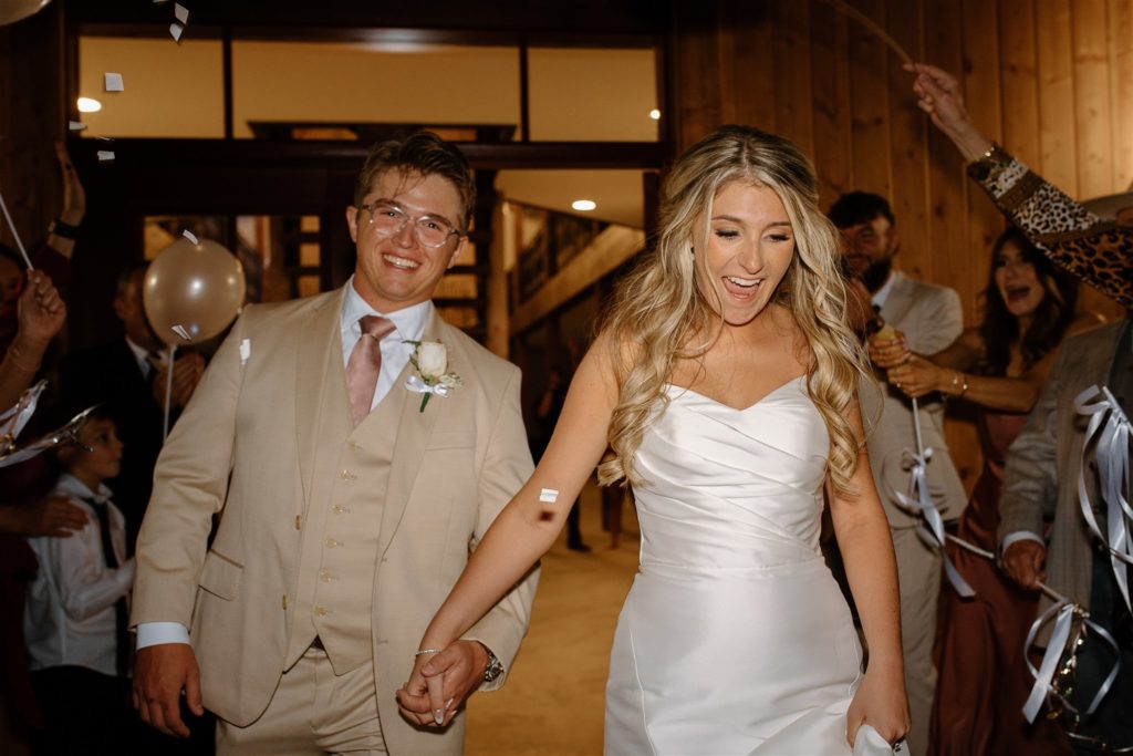 Wedding exit with streamers and confetti poppers for bride and groom.