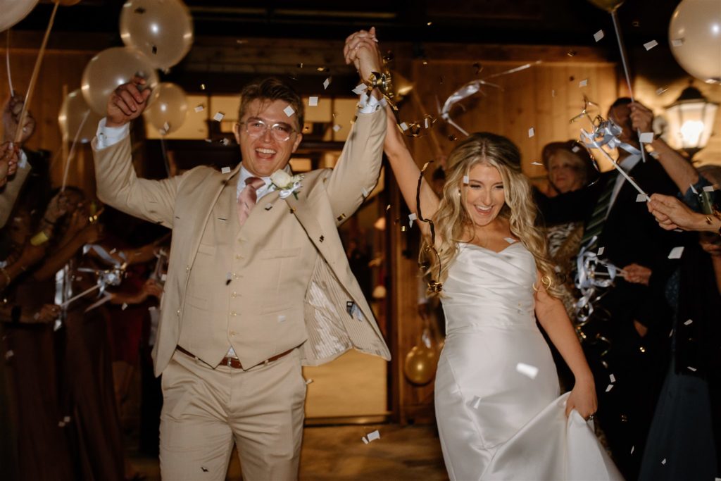 Streamers cover bride and groom during wedding exit from texas wedding.