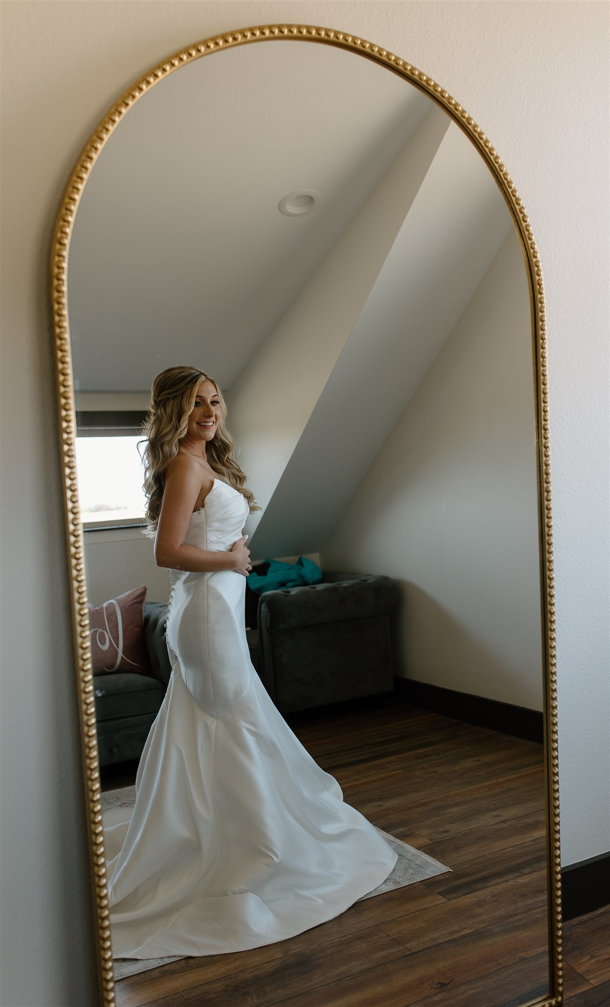 Bride gets into dress in front of Anthropologie mirror dupe.