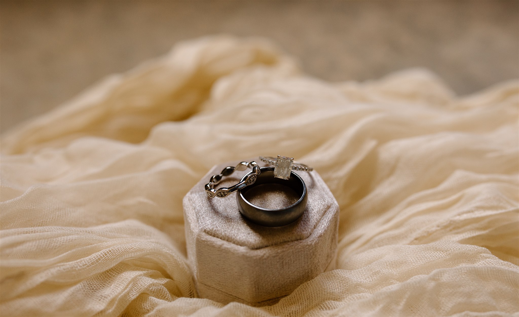 Wedding rings details with pink box.