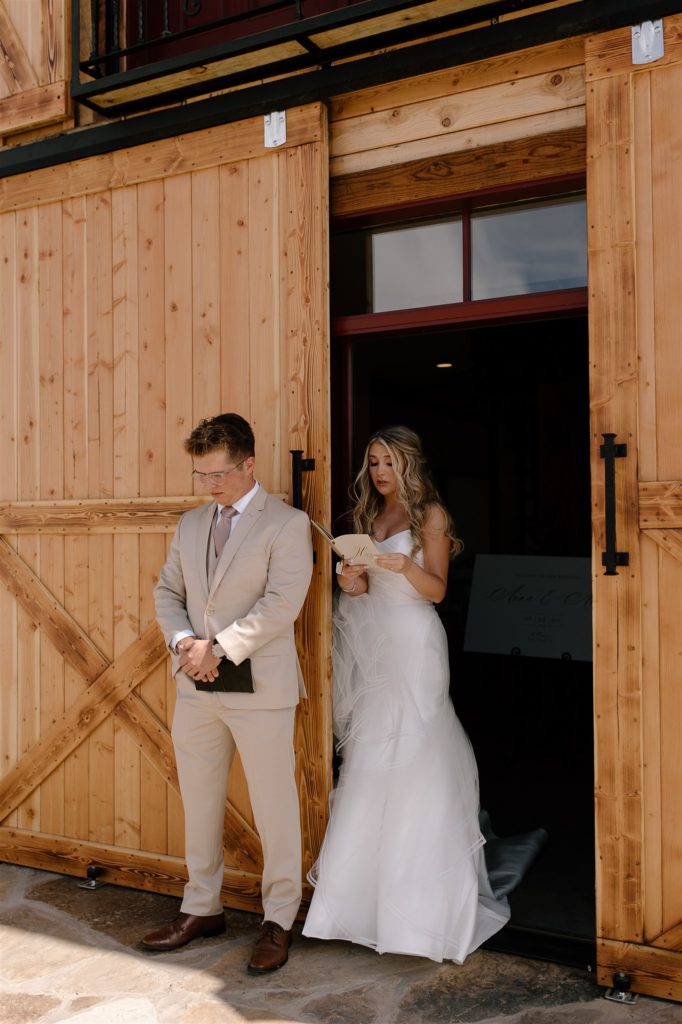 Bride reads vows to groom during first touch.