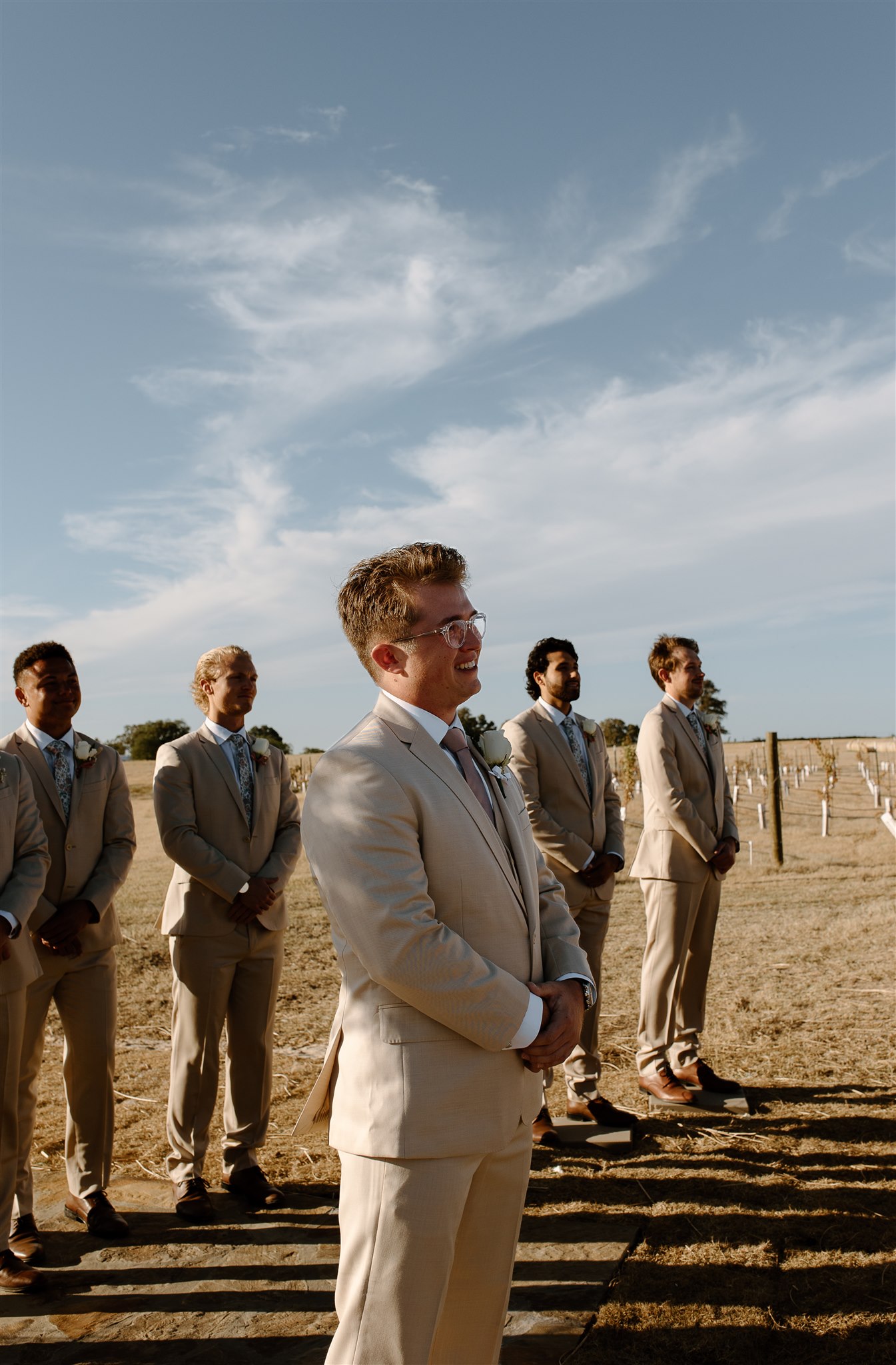 Groom's emotional first look down the aisle at the bride.