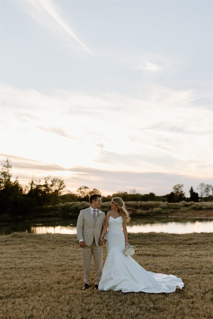 Bride and groom pose during texas wedding portraits.