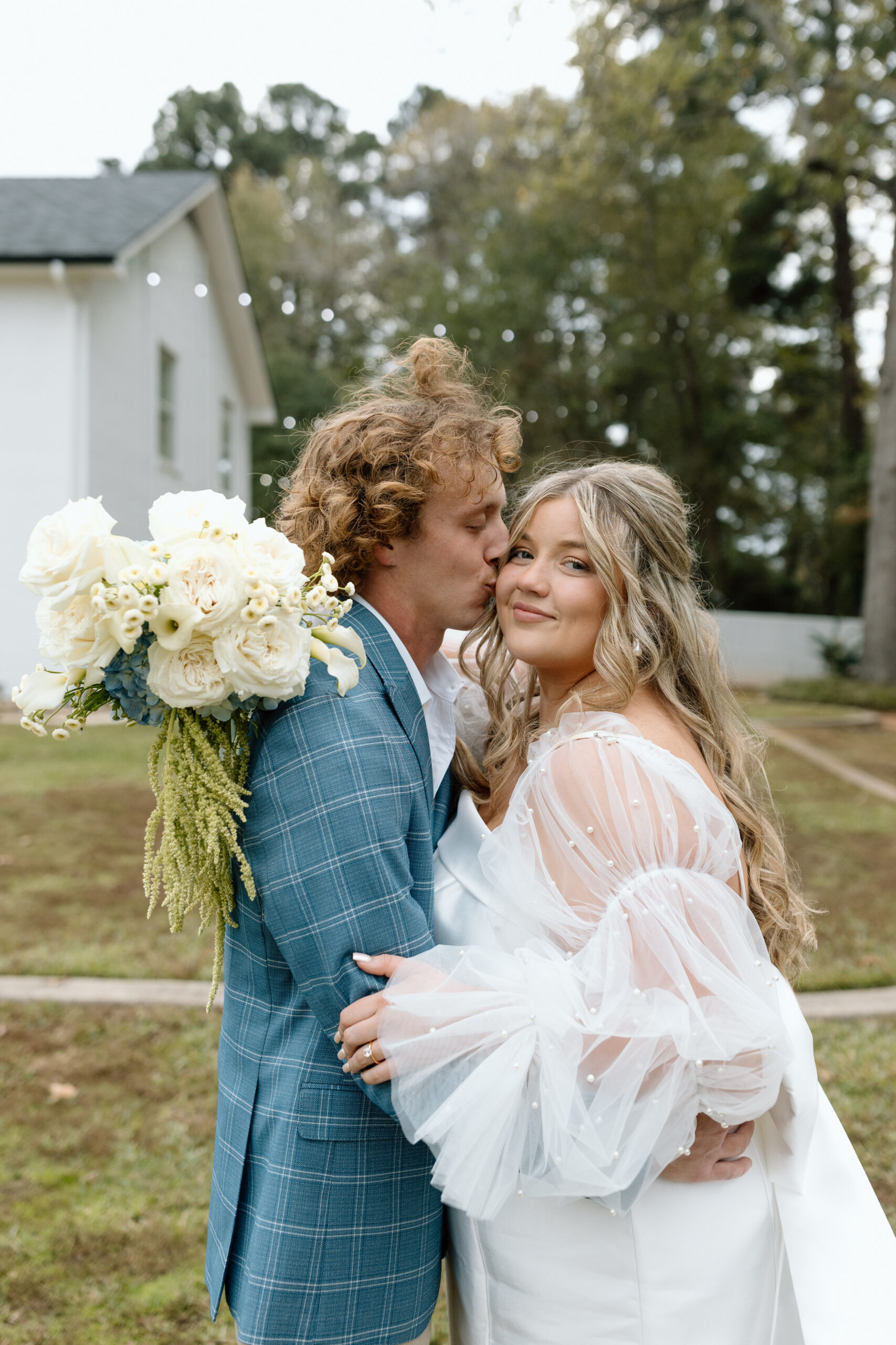 Bride and groom poses for camera at East Texas Wedding Venue, The Chateau of Longview.